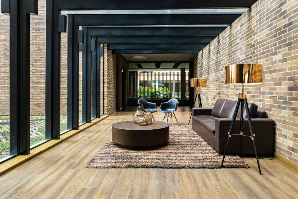 Contemporary home interior with leather couch and wooden floor in Bogota.
